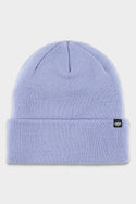 The 686 Standard Roll Up Beanie by 686 is a light purple knit hat with a folded brim, featuring a small black rectangular tag with a white logo on the edge. The beanie is displayed flat on a white background.