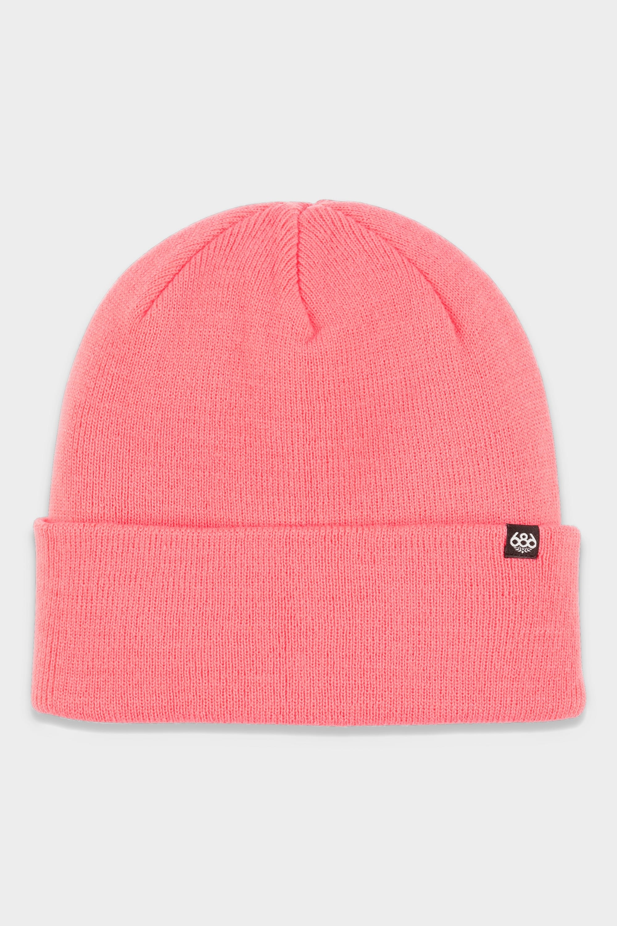 The 686 Standard Roll Up Beanie by 686 is a bright pink knit hat with a folded cuff and a small black tag featuring a white logo on the left side, shown against a plain light gray background.