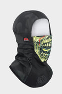 Introducing the 686 Alpha Hinged Balaclava (WN2526), featuring a grotesque green zombie face over the mouth and nose, a red and black 686 logo on the side, and a uniquely patterned hood for added style.