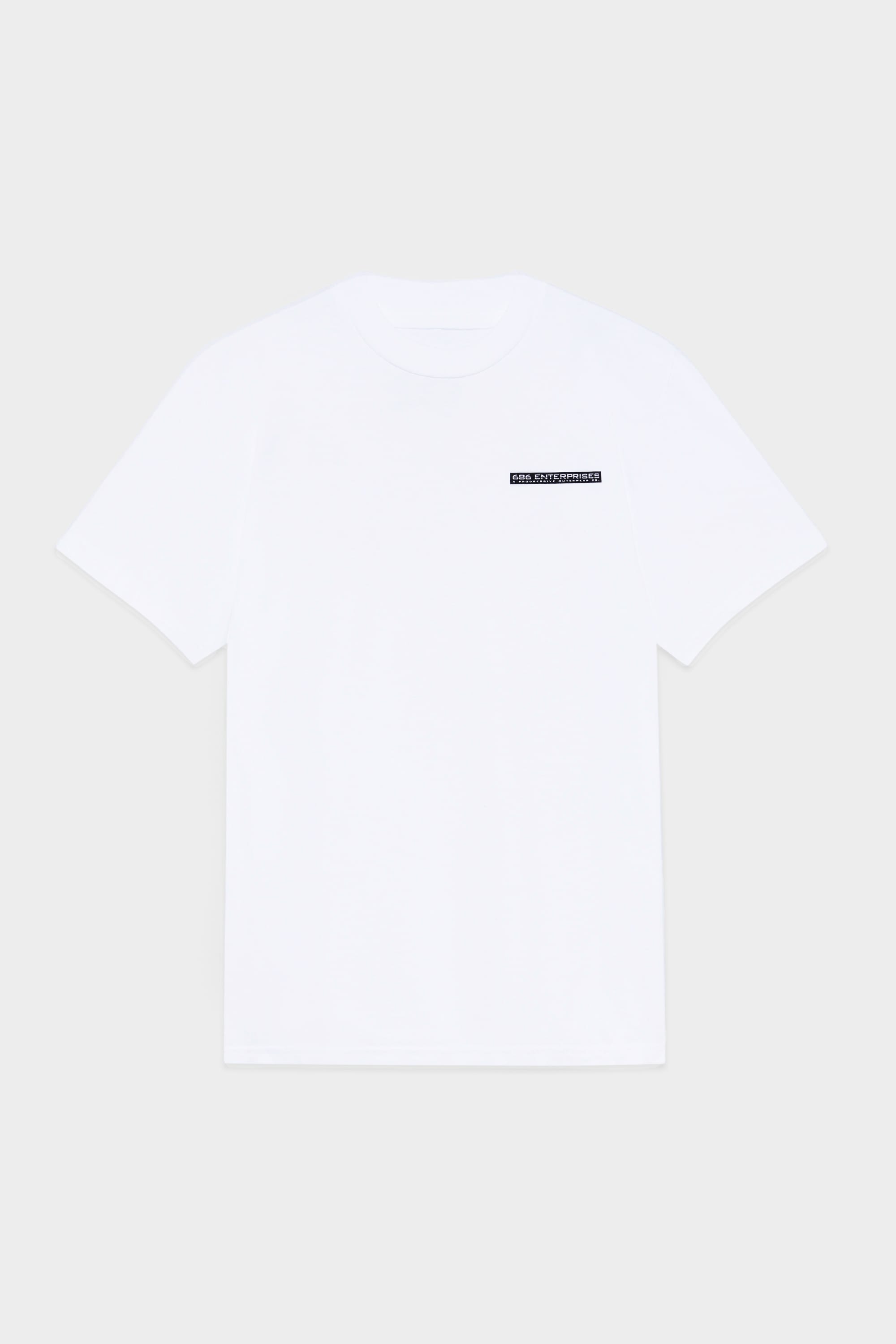 The 686 Mens Global Enterprises Short Sleeve Tee by 686 features a vintage fit and a small rectangular black label with white text on the left chest. Its displayed against a light gray background.