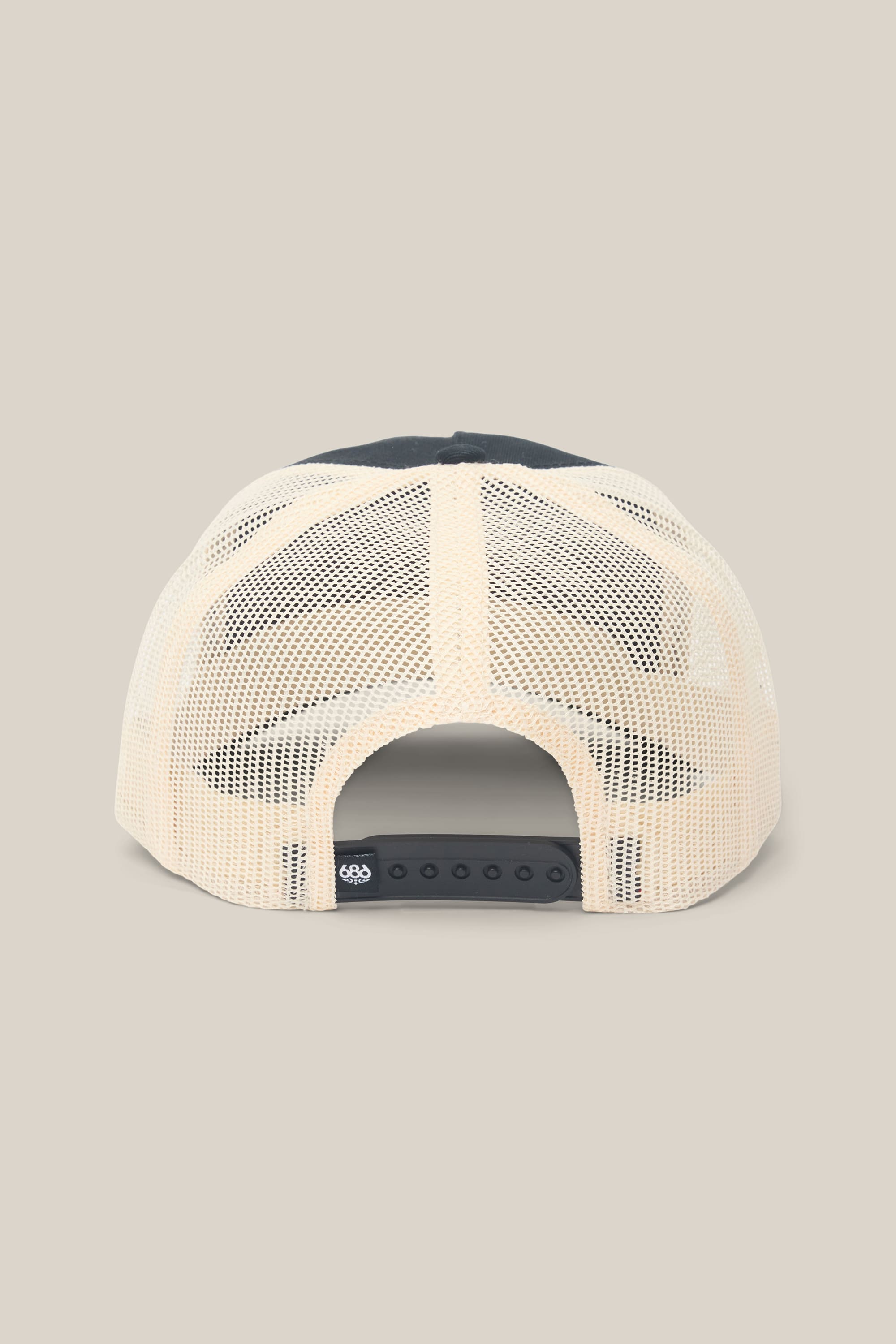 The 686 Mid-Pro Wreath Unstructured 5 Panel Mesh Hat by 686 is shown from the back, featuring a beige mesh back crafted from a polyester cotton blend, an adjustable black snap closure, and a small black tag at the bottom.