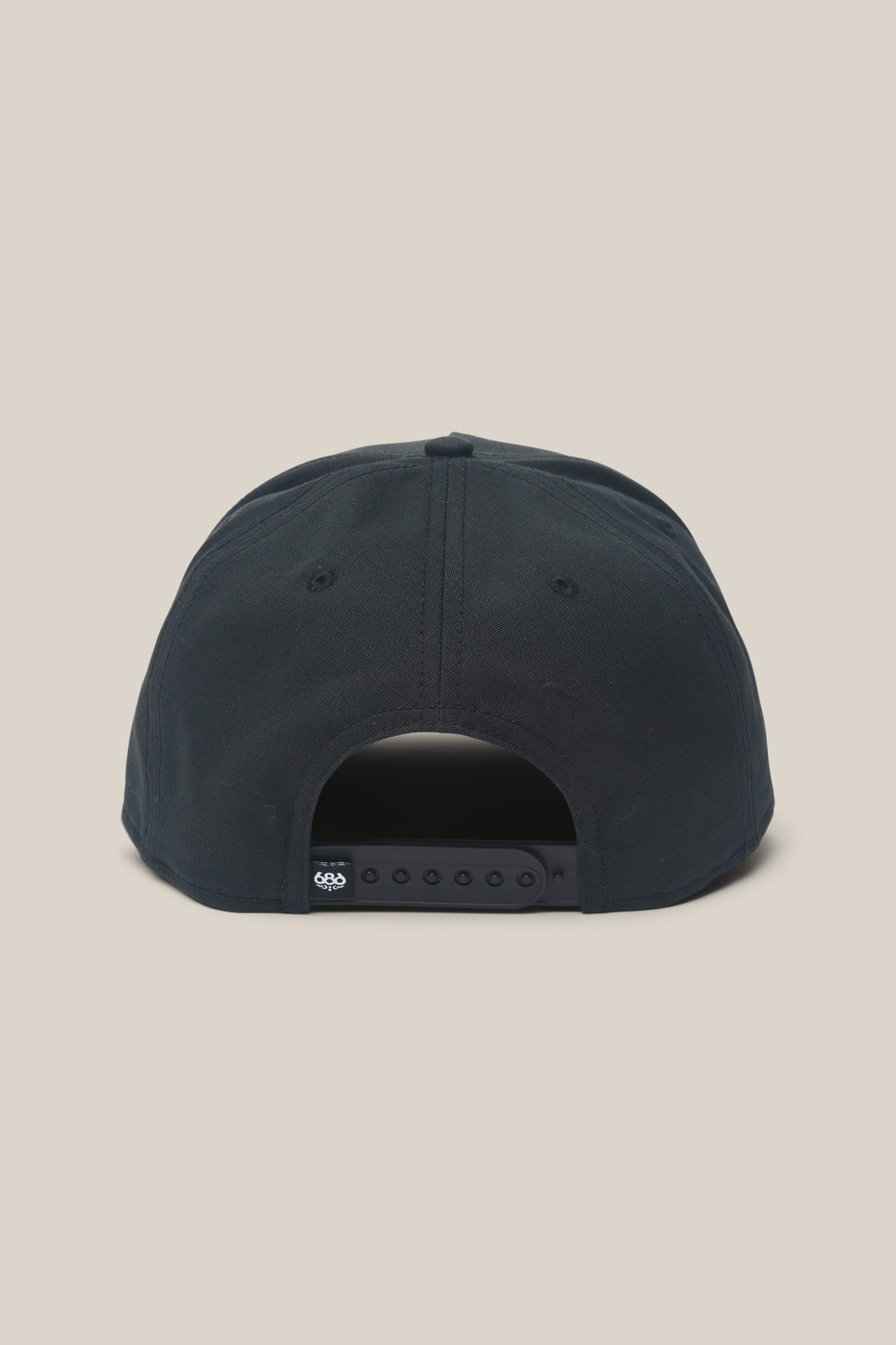 The 686 High-Pro 92 Structured 5 Panel Hat by 686 is a black men's polyester-cotton hat with an adjustable snapback closure, two embroidered eyelets per side, and shown from the back against a plain beige background.
