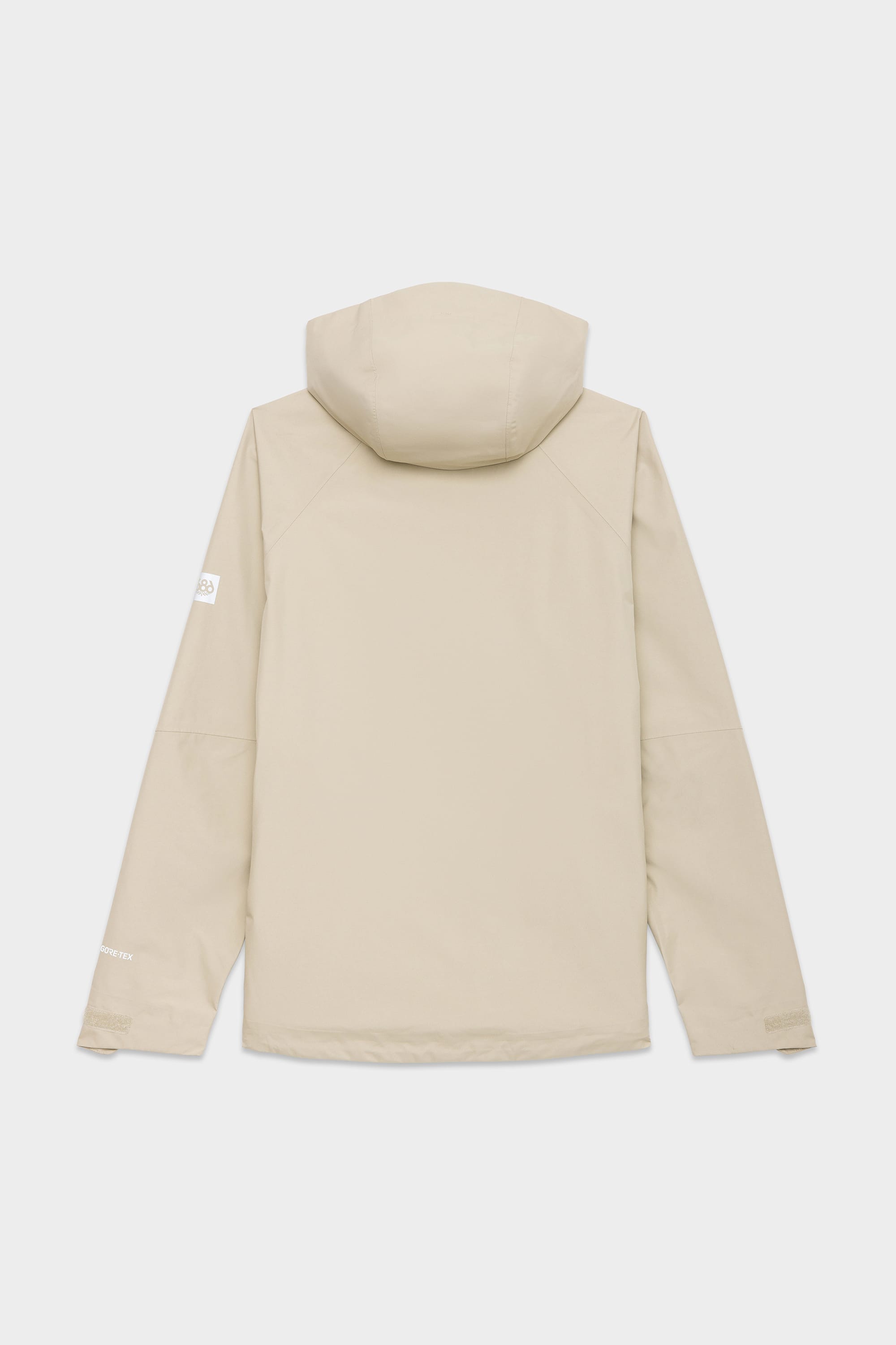 The 686 Mens GORE-TEX PACLITE® Jacket in beige is shown from the back, with long sleeves, a clean minimalist design, and a subtle 686 logo on the left sleeve.