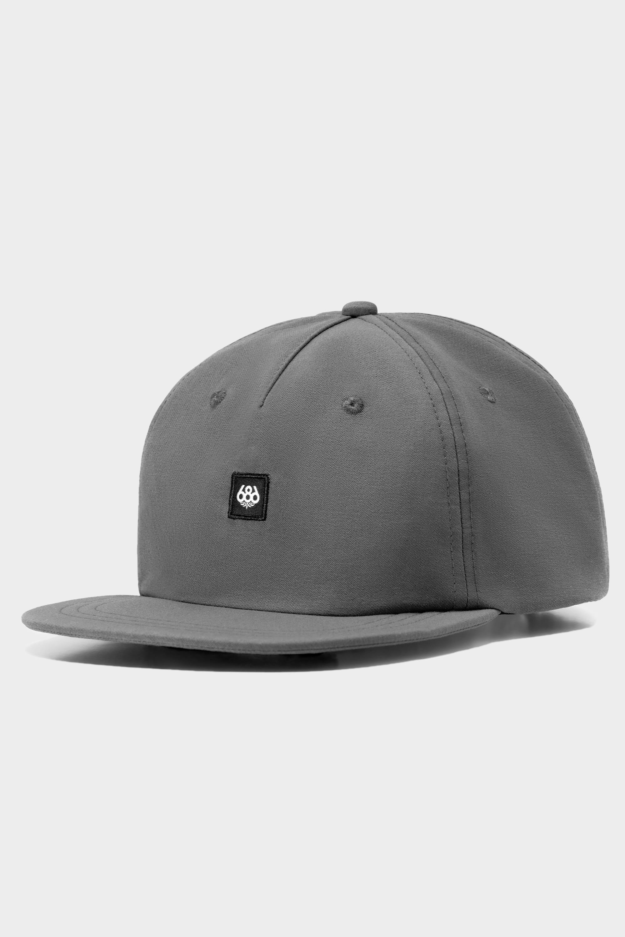 The 686 Packable Everywhere Hat by 686 is a plain gray snapback cap with a flat brim and a small black patch featuring a white logo on the front, shown against a light gray background.