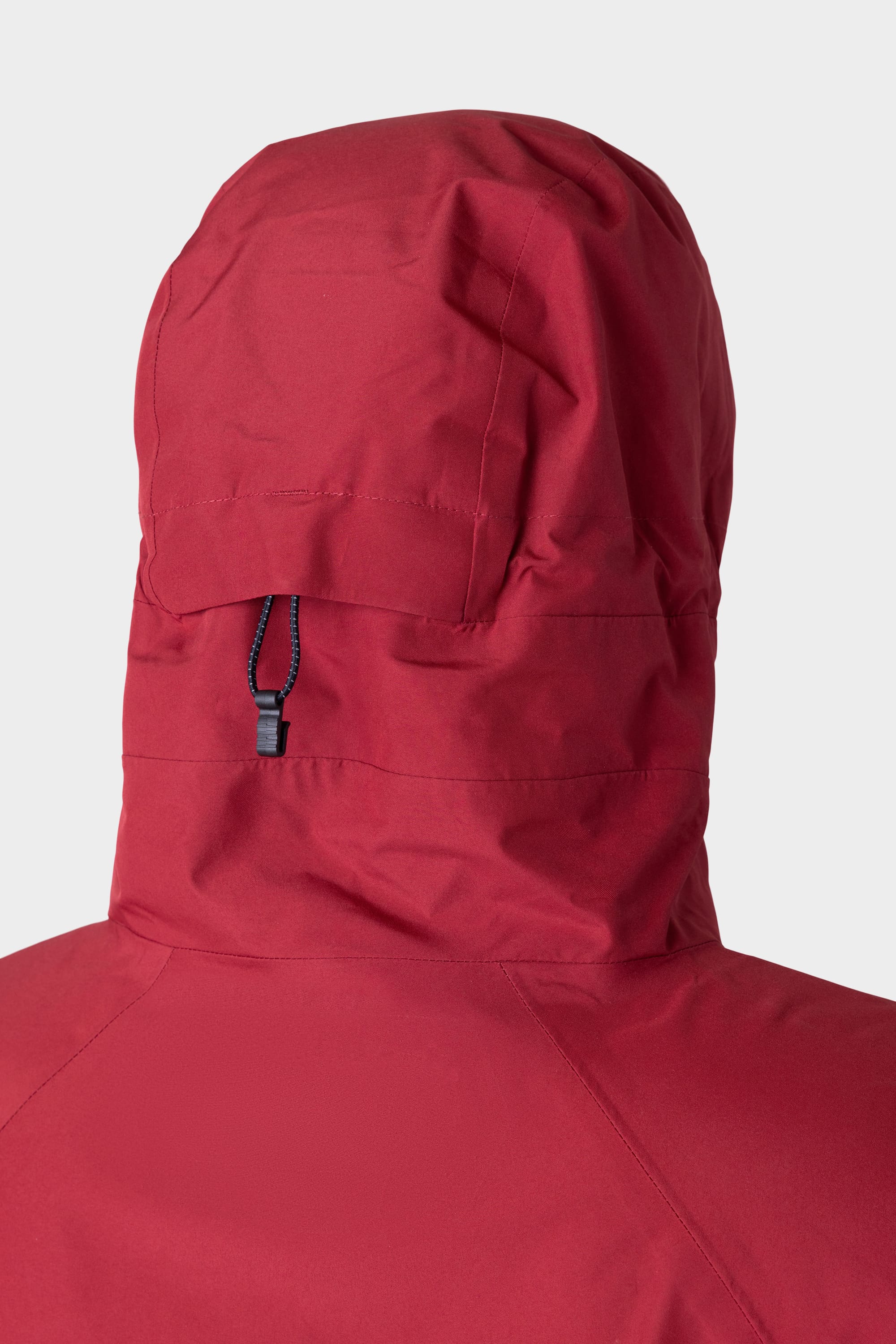 Close-up of the back of the 686 Mens GORE-TEX PACLITE® Jacket in red, showing black adjustable drawstring and hood stitching details by 686, set against a plain light background.