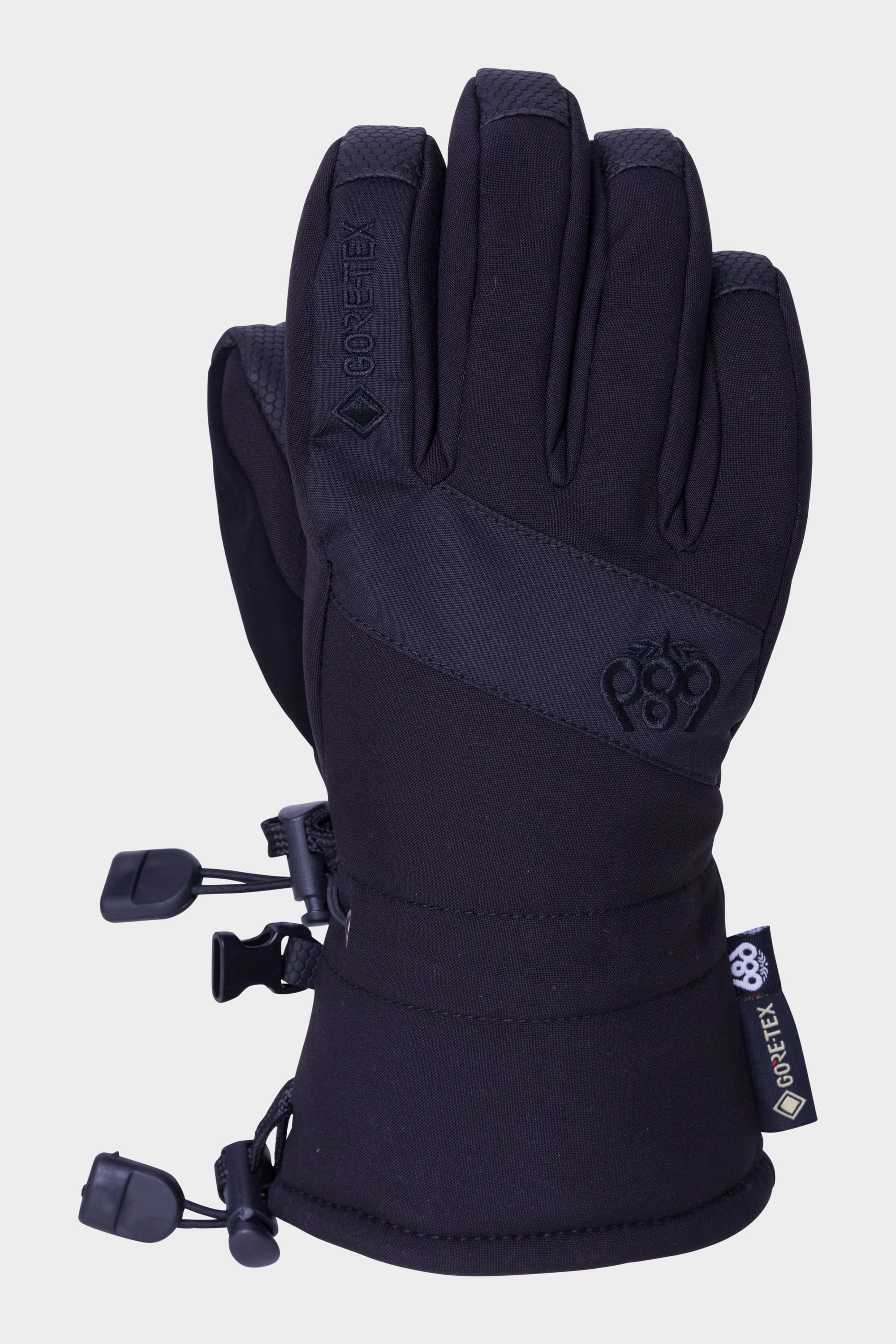 The 686 Youth GORE-TEX Linear Glove, in black, features adjustable wrist straps and reinforced fingertips. A single scaled down glove with a visible GORE-TEX tag is shown against a plain white background.