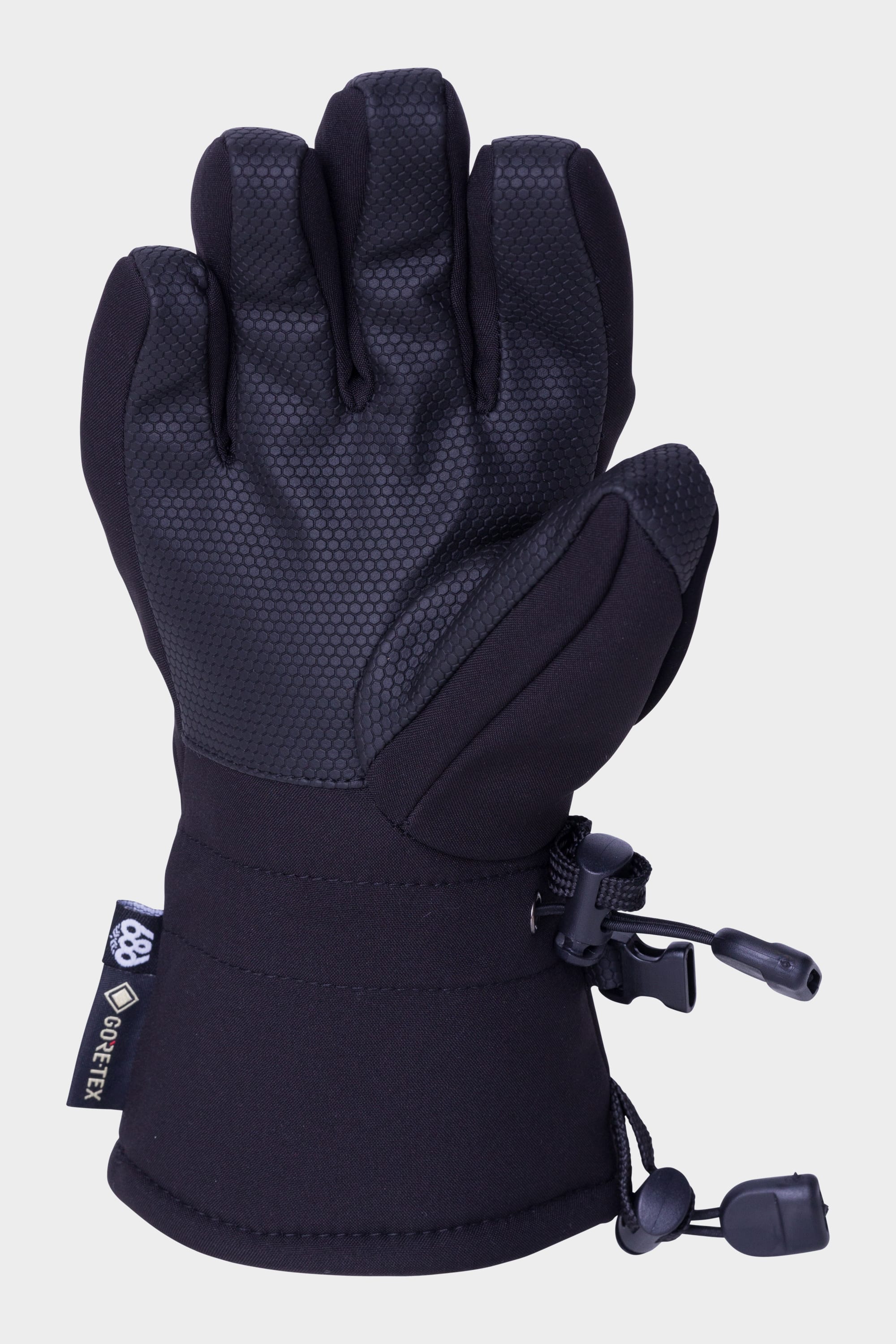 The 686 Youth GORE-TEX Linear Glove by 686 is a black glove with a textured palm, adjustable wrist strap, and toggle fastener, displayed against a plain light background with fingers slightly bent inward.