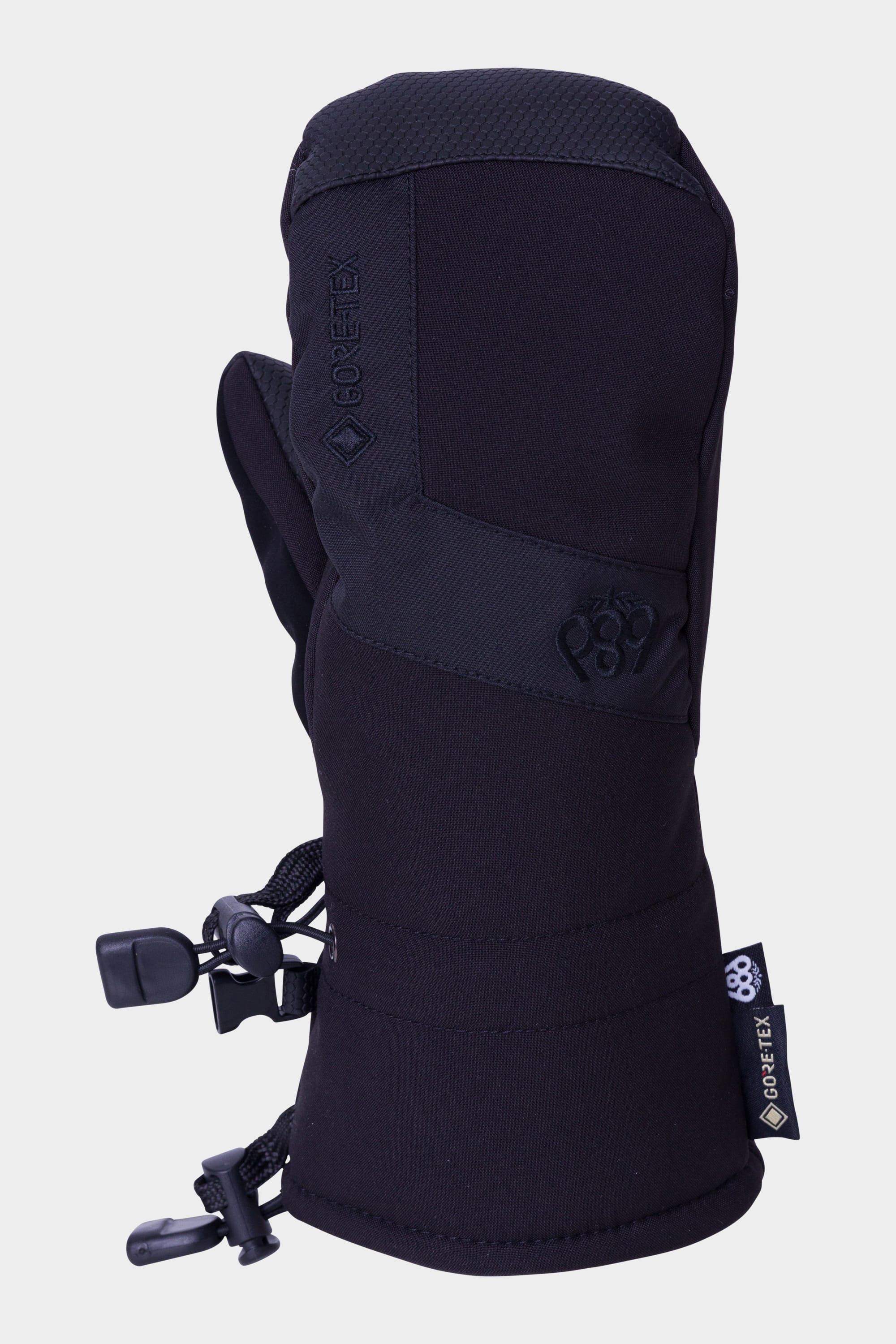 The 686 Youth GORE-TEX Linear Mitt features durable fabric, an adjustable wrist strap, cuff cinch cord, and GORE-TEX tags—offering uncompromised cold weather protection in a scaled-down black mitten for kids.
