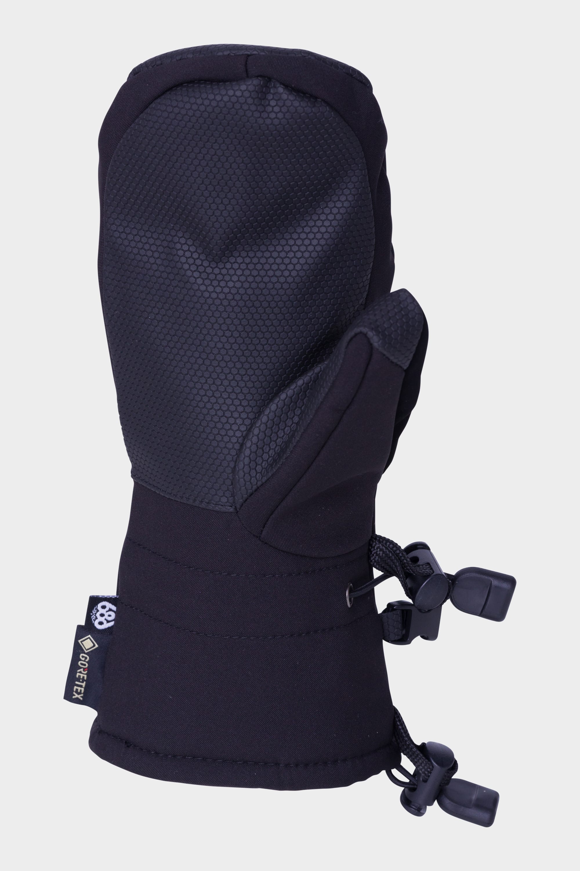The 686 Youth GORE-TEX Linear Mitt by 686 features a black design, textured grip on palm and thumb, adjustable wrist straps, and a GORE-TEX tag—offering uncompromising warmth and durability for winter wear.