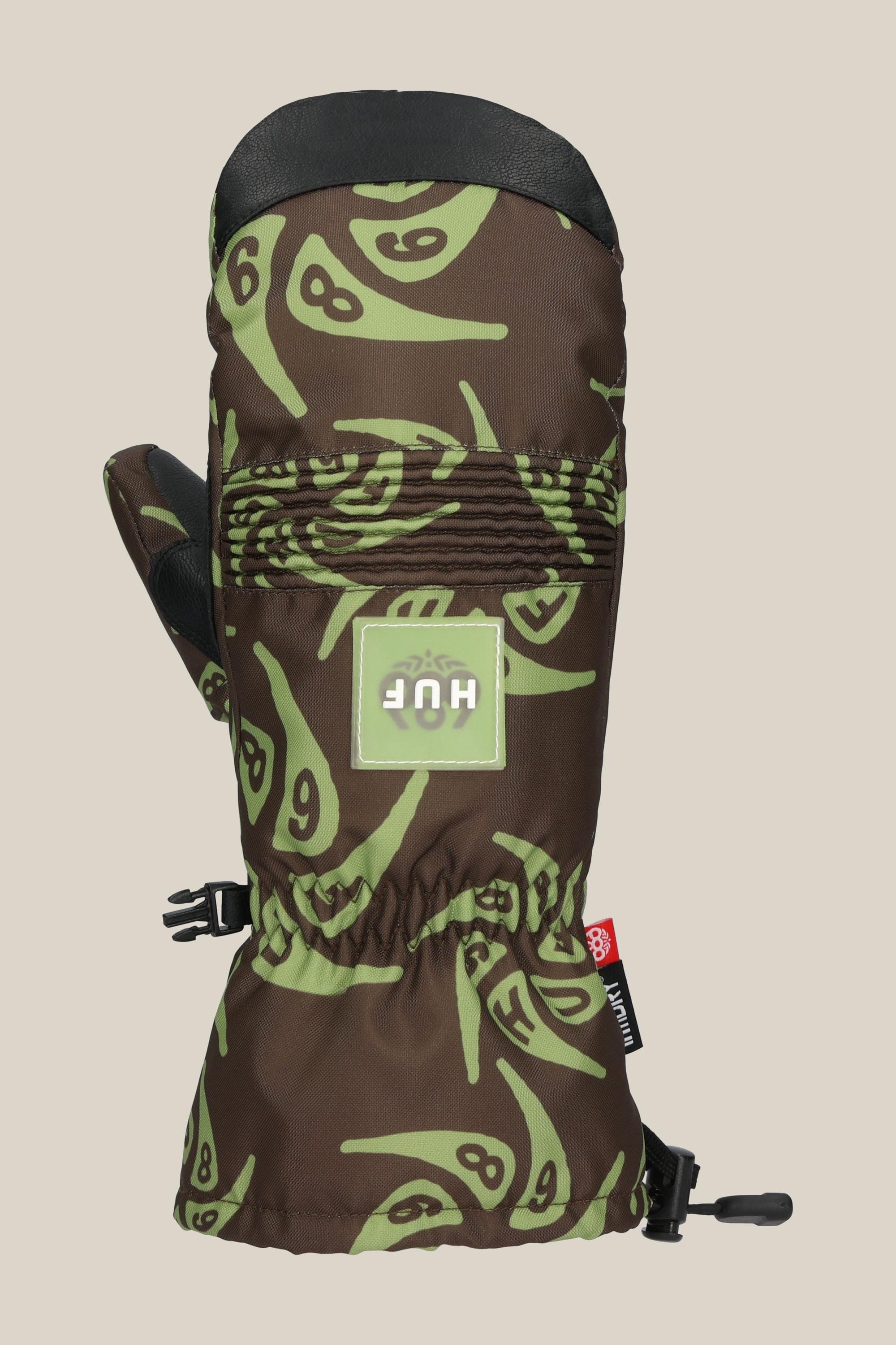 The 686 Lander Mitt by 686 features a brown and green melting clock pattern, light insulation, black strap, front logo patch, gathered wrist, 10k waterproofing, and a clip for attaching to another glove.