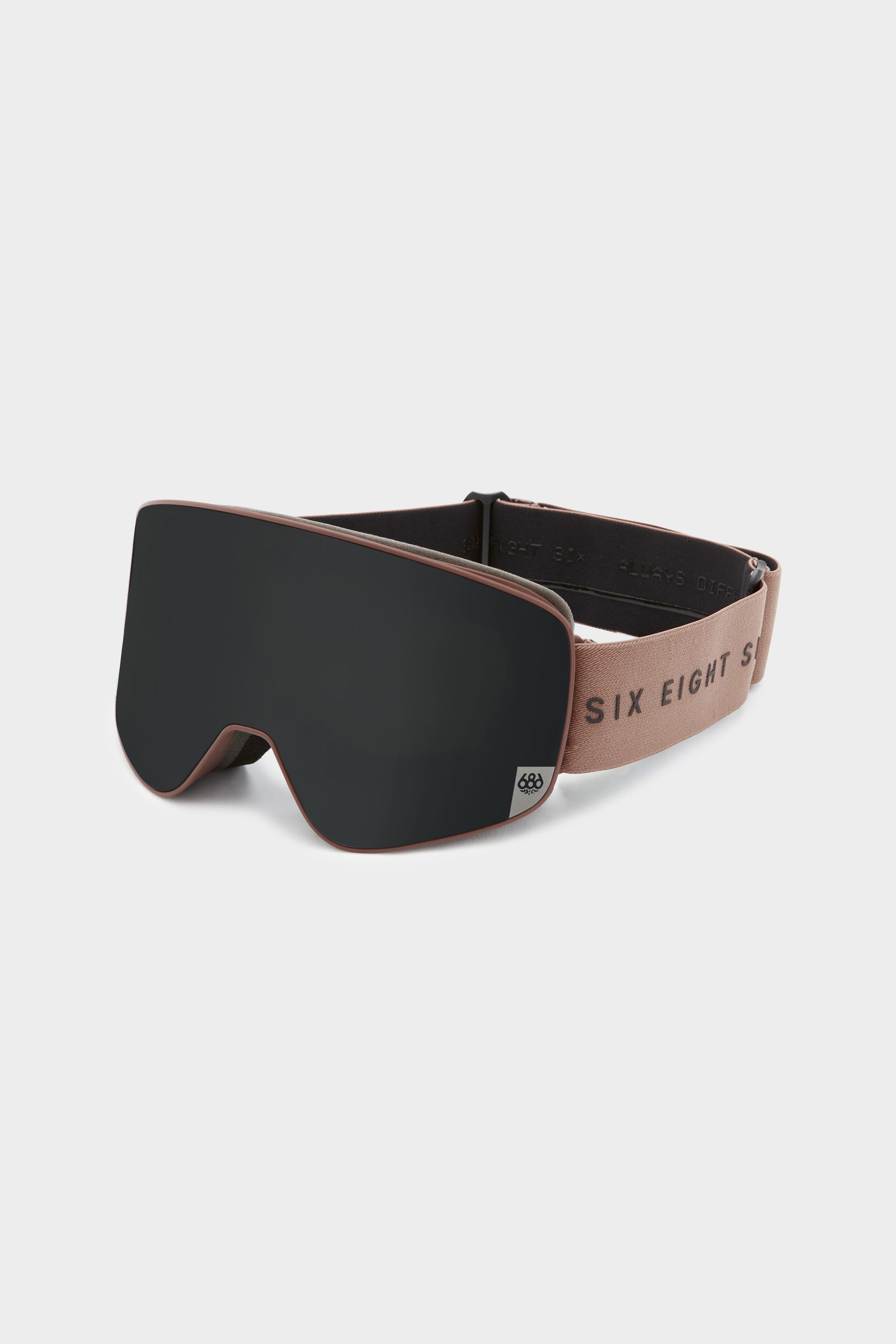 The 686 SMARTY Goggle by 686 features a sleek black minimalist design with a brown frame, adjustable brown strap printed with SIX EIGHT SIX in black, and magnetic lenses for all conditions—all set against a plain white background.