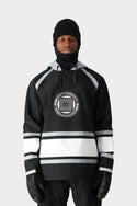 A person wearing the 686 Mens Waterproof Slapshot Hoody by 686, featuring black and white colors, a circular front logo, and 688 ENTERPRISES text, along with black gloves, a knit beanie, and face covering against a plain light background.