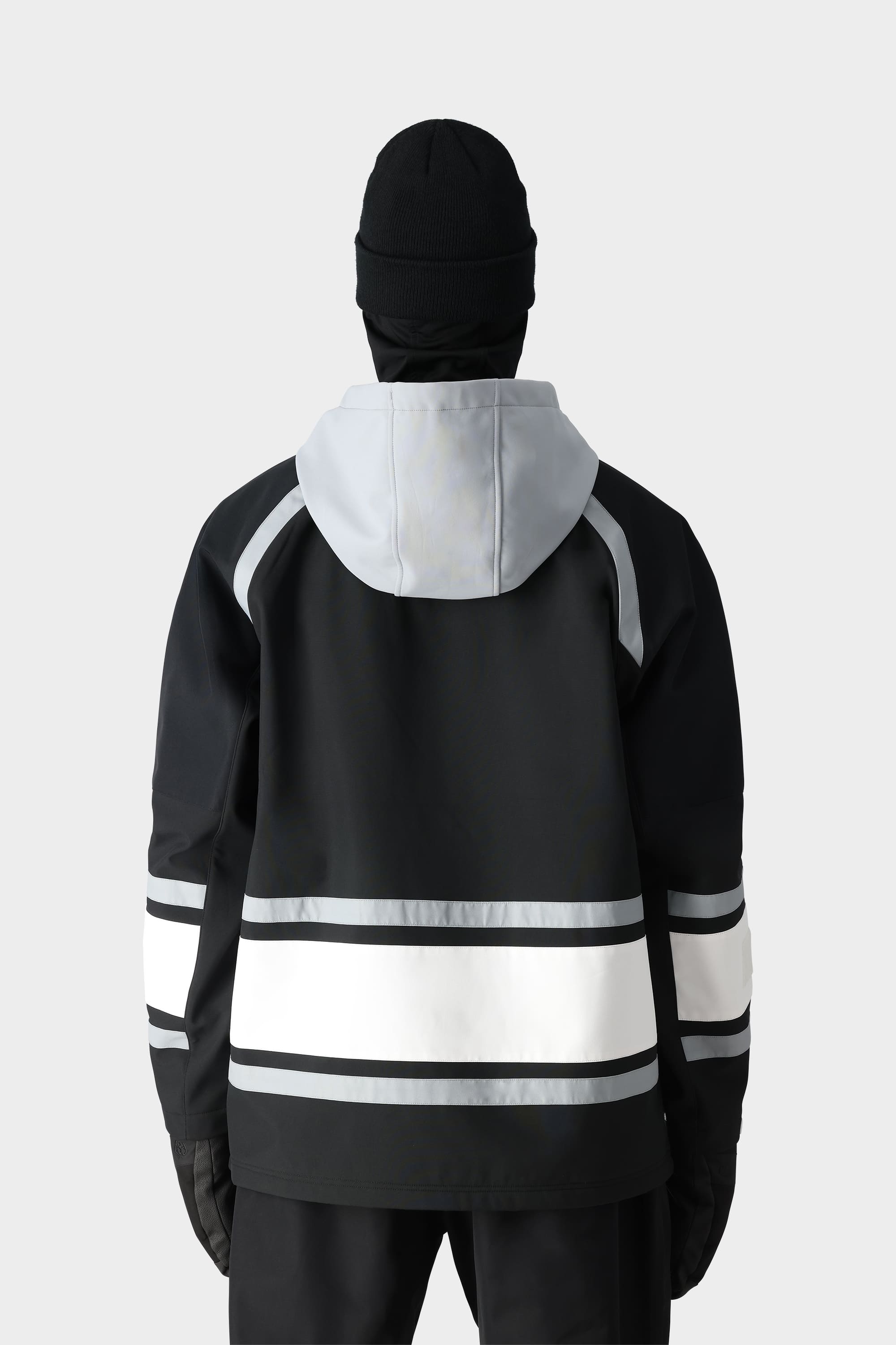 A person wearing the 686 Mens Waterproof Slapshot Hoody and black beanie and gloves is seen from the back against a plain light background.