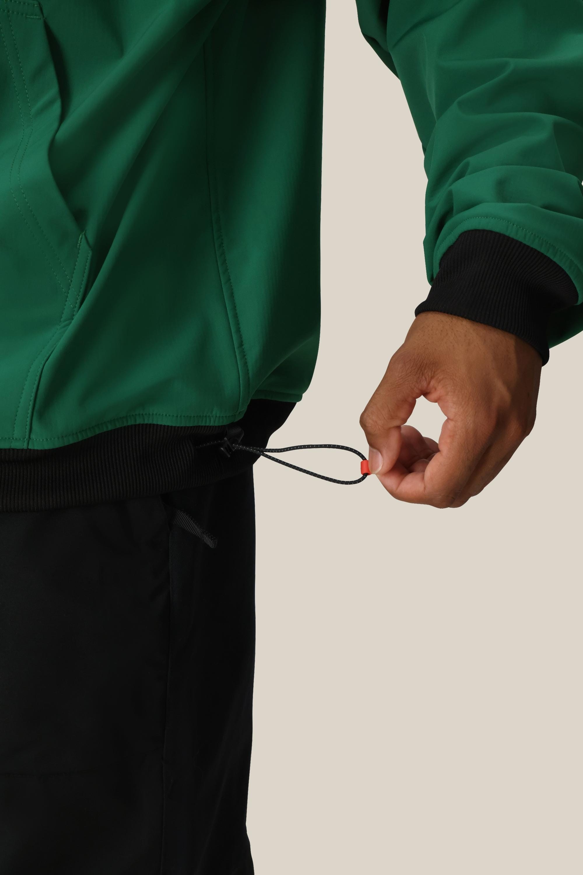 A Ford car key with a red keychain clip rests on what appears to be the pocket of a 686 Mens Waterproof Team Hoody jacket by 686.