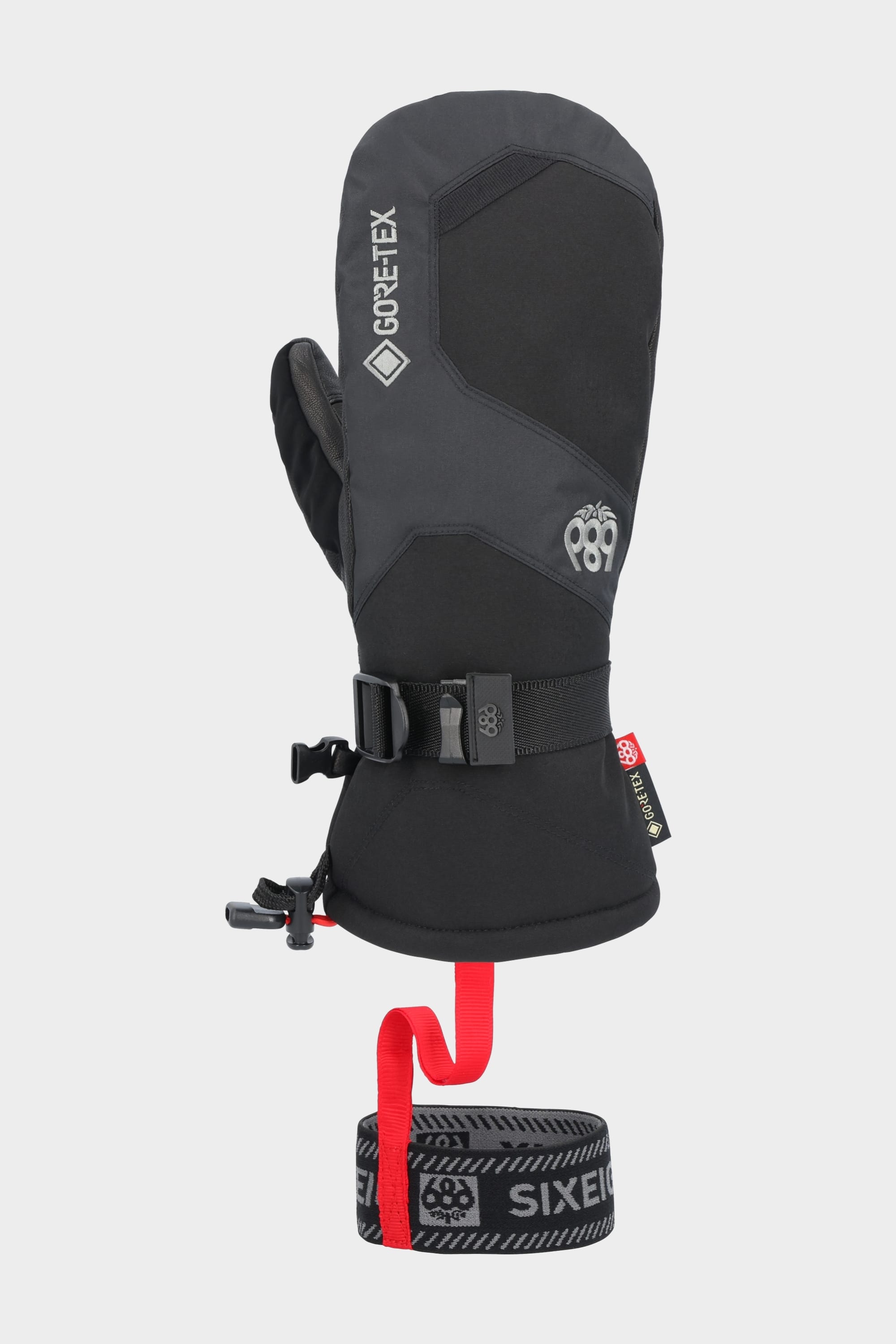 The 686 Men’s GORE-TEX Leather Linear Mitt features a black and gray design, durable leather palm, adjustable wrist strap, red leash, and logo detail on the back, shown against a neutral background.
