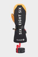 The 686 Mens GORE-TEX Leather Deep Days Mitt is a black and yellow mitten with bold SIX EIGHT SIX in white, GORE-TEX waterproofing, an adjustable strap, wrist cinch, Gore-Tex logo, and a detachable black leash with red loop.