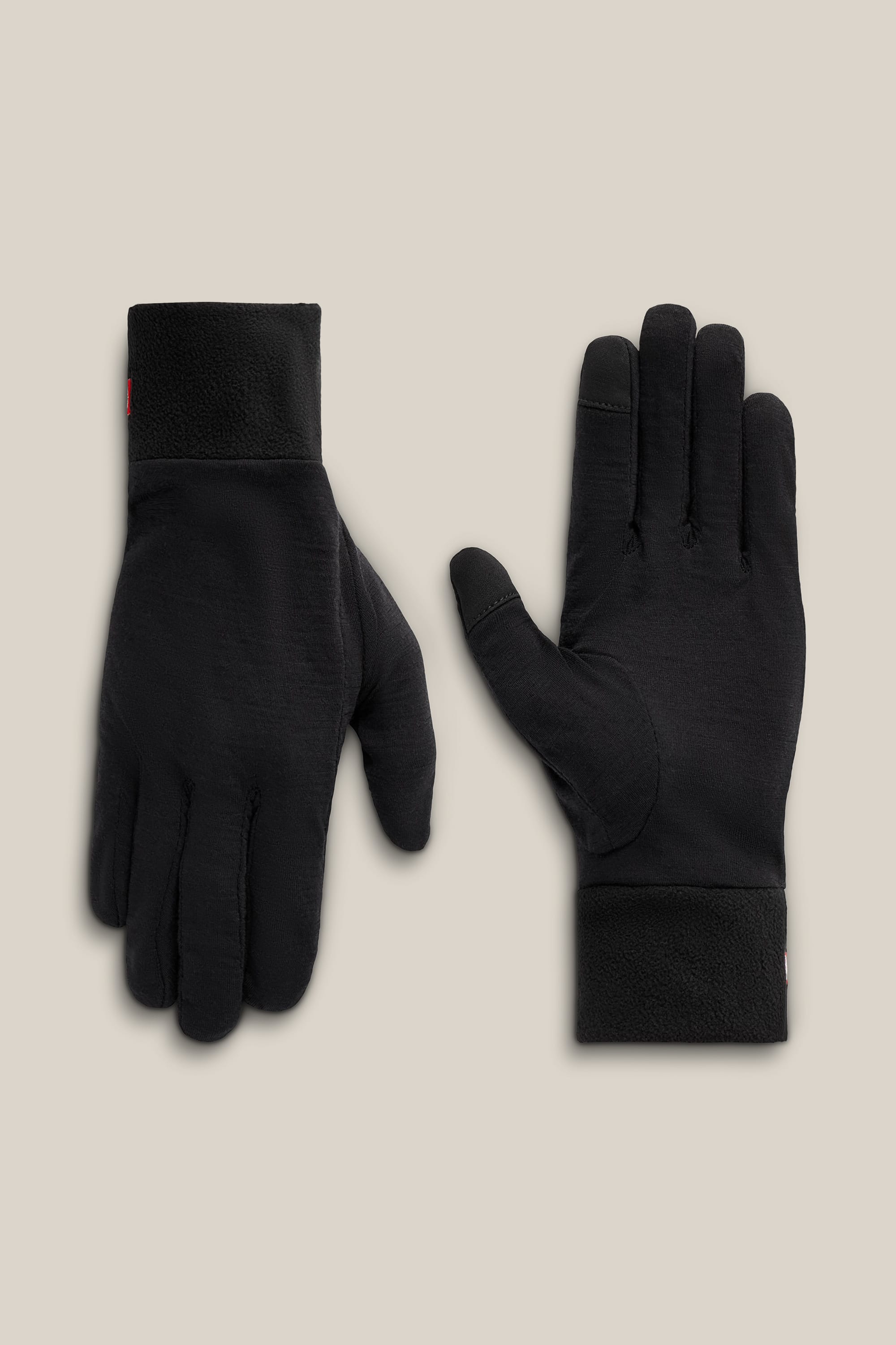 The 686 Men’s GORE-TEX® SMARTY® 3-In-1 Gauntlet Gloves by 686 are displayed on a beige background, with one glove positioned palm up and the other palm down.
