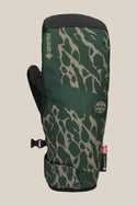 The 686 Mens GORE-TEX Linear Under Cuff Mitt by 686 features a green camouflage pattern, black PU palm, adjustable wrist strap, and GORE-TEX branding, shown against a beige background.