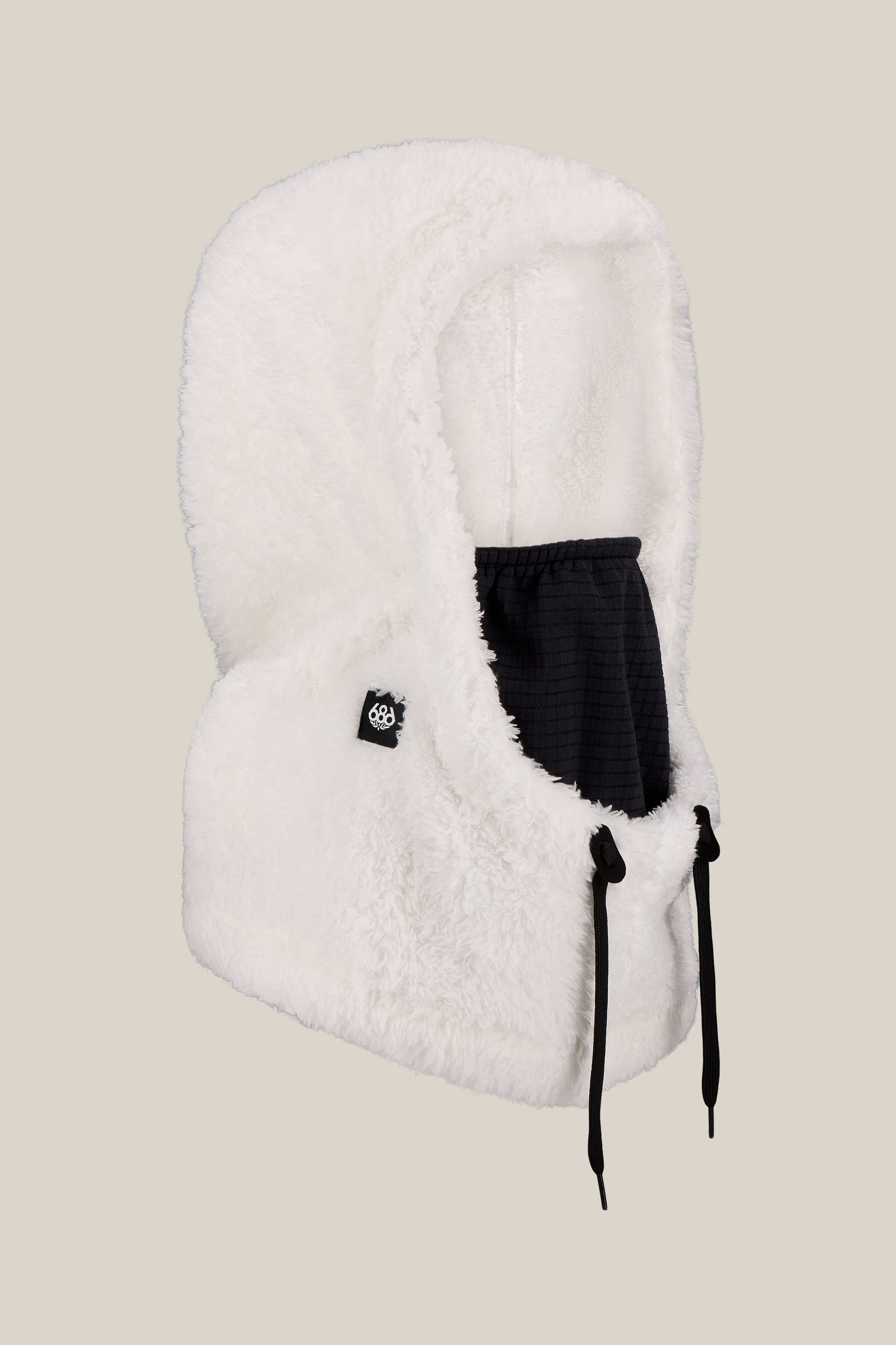 The 686 Tarmac Sherpa Hood by 686 is a fluffy white unisex hood with a black adjustable polyester facemask and drawstrings, shown on a plain beige background.