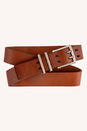 The Westwell 686 Westwell Voyager Belt features brown leather, a silver rectangular buckle, and two loops, displayed coiled in a loose spiral against a plain light background.