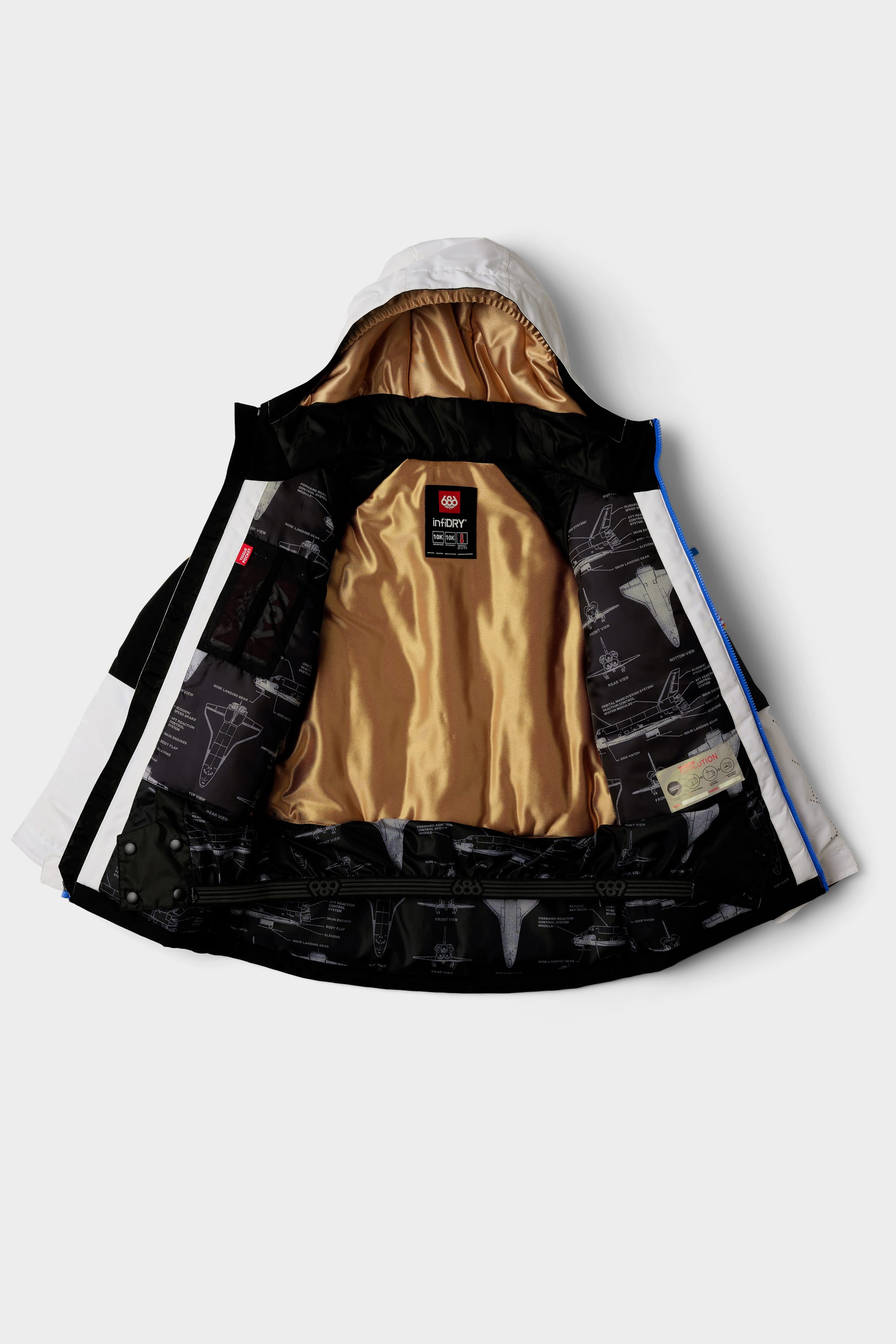 The 686 Youth Exploration Insulated Jacket is shown laid flat with its front open, displaying a shiny gold inner lining, black fabric featuring diagram patterns, and a visible 686 brand label on the back neck area.