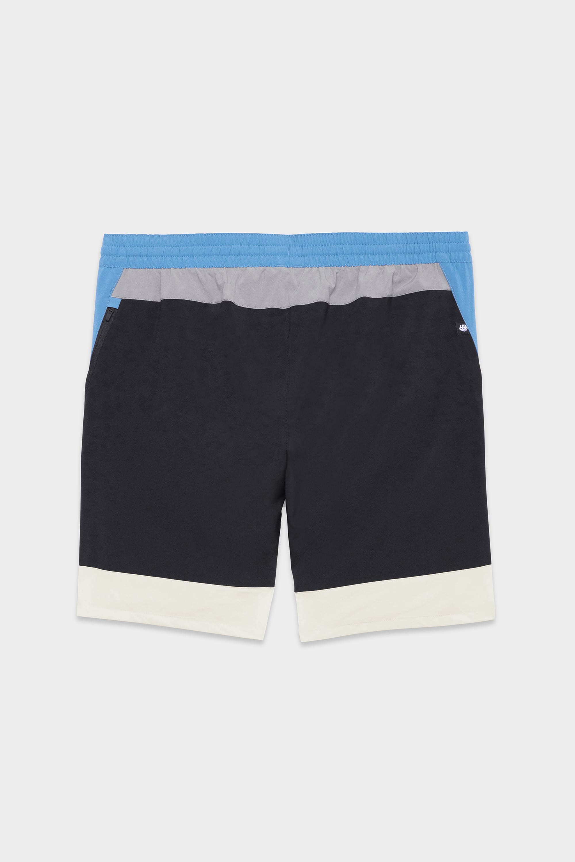 The 686 Mens ATP Stretch Performance Short by 686 features color-blocking with blue on top, a gray band, black in the middle, and white at the bottom. These shorts have an elastic waistband and side pockets, shown laid flat on a white background.