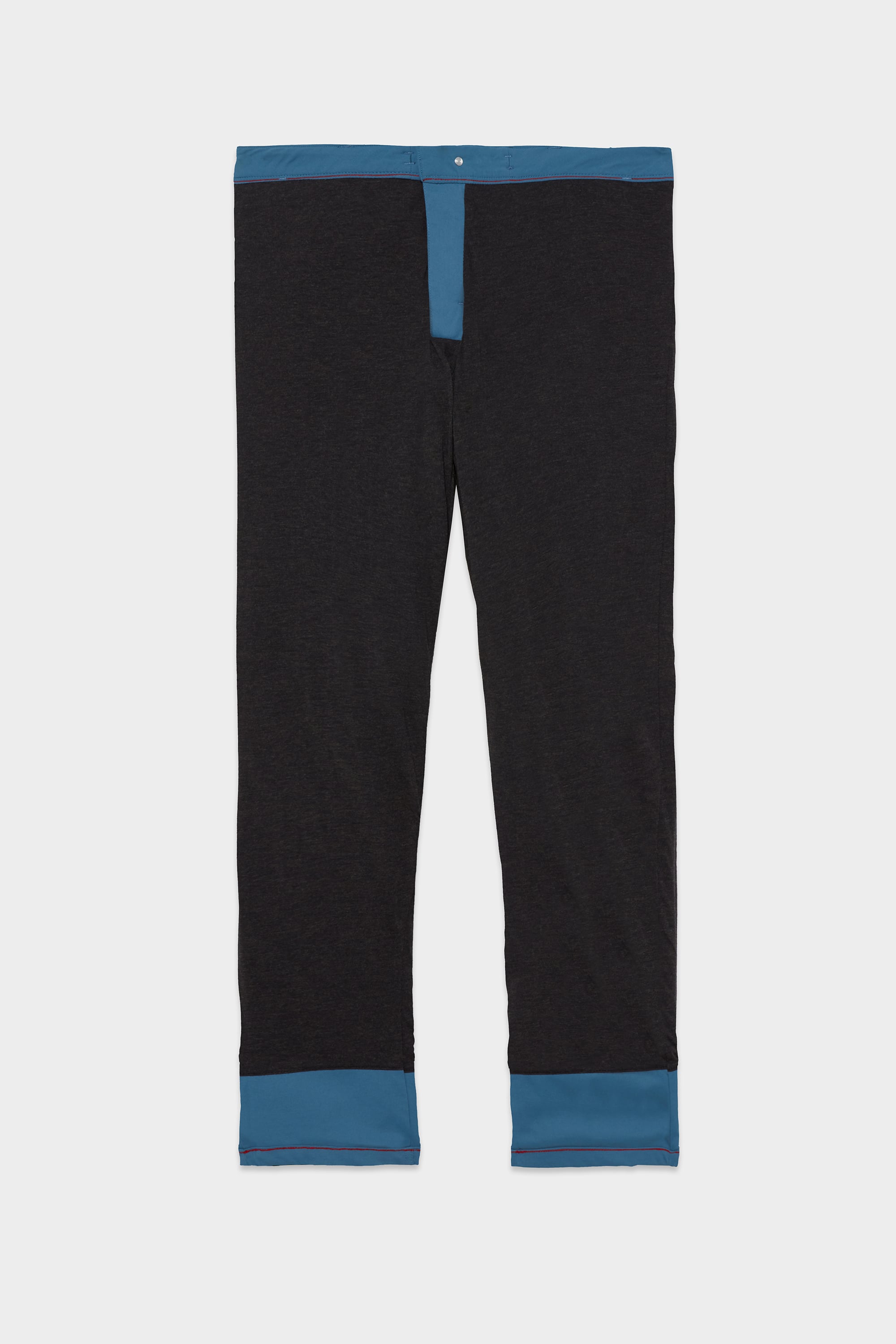 The 686 Mens Everywhere Merino-Lined Pant - Slim Fit features a sleek black design with blue accents, shown flat on a white background—perfect for warmth and comfort in cold weather.